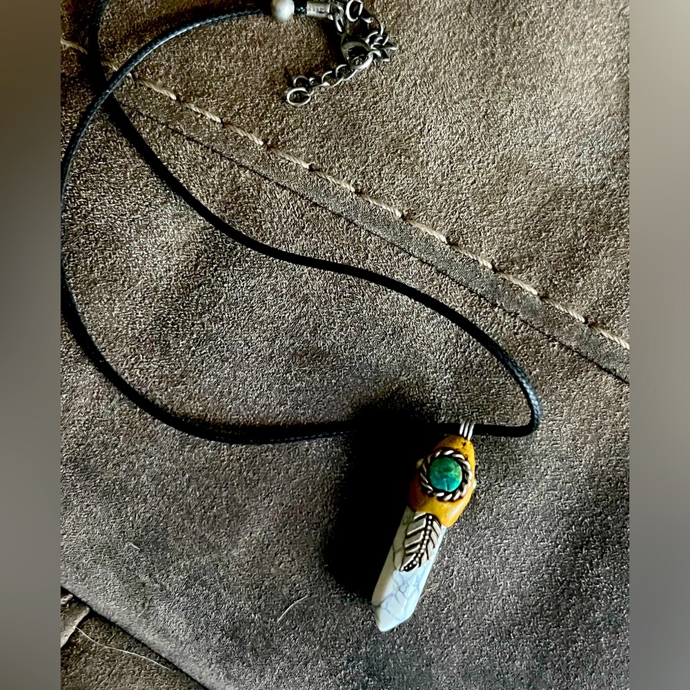 This beautiful native piece with turquoise and stone.